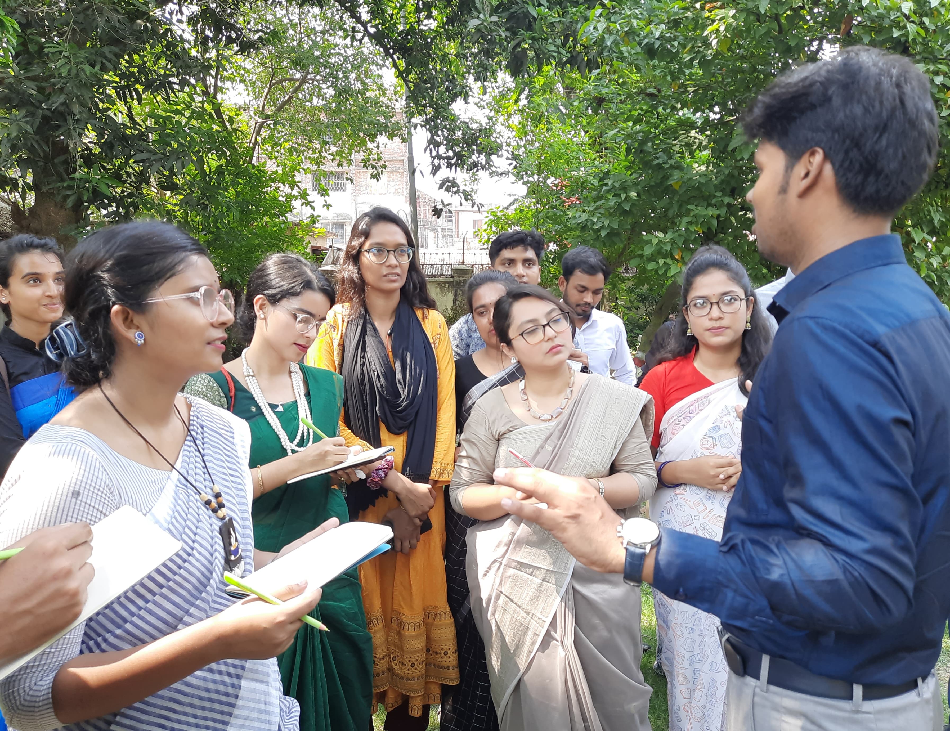 BKSR field mentoring — researchers in discussion with students during data collection